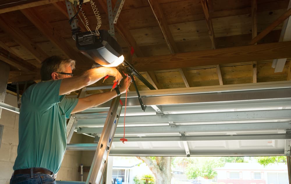 company-worker-installing-a-garage-door